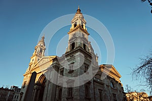 St. Stephen's Basilica in Budapest (Hungary) during sunset with clear blue sky - historical church