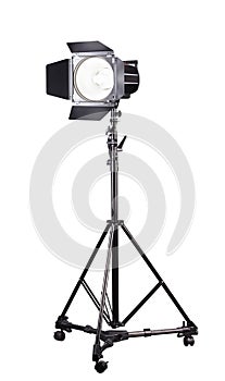 Photography studio flash on a lighting stand isolated on white background