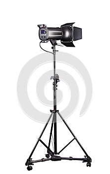 Photography studio flash on a lighting stand isolated on white background