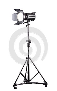 Photography studio flash on a lighting stand isolated on white background.