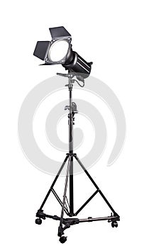 Photography studio flash on a lighting stand isolated on white background.