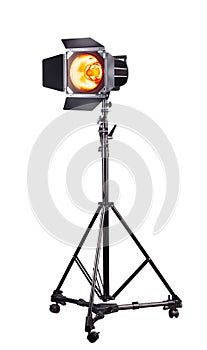 Photography studio flash on a lighting stand isolated on white background.