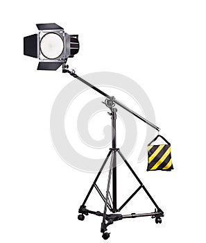 Photography studio flash on a lighting stand isolated on white background.