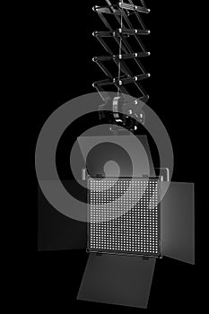 Photography studio led flash light on ceiling pantograph isolated on black