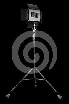 Photography studio led flash light on a tripod stand isolated on black