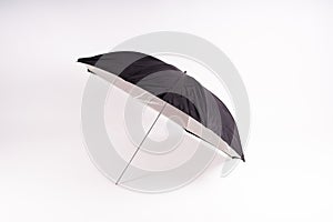 Photography studio light reflector - isolated on white background umbrella.
