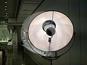 Photography studio light reflector style floor lamp standing in showroom