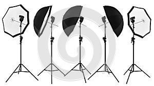 Photography studio lighting stand with speedlight and umbrella isolated on white