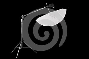 Photography studio speedlight on boom with stand and umbrella isolated on black