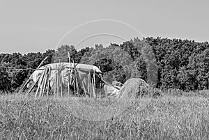 Photography on theme big dry haystack in grass farm field