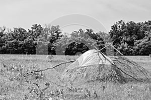 Photography on theme big dry haystack in grass farm field