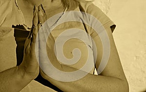 Photography of woman making praying gesture with her hands