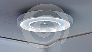 Photorealistic image of a smart ceiling light with dimming and scheduling in a studio setting