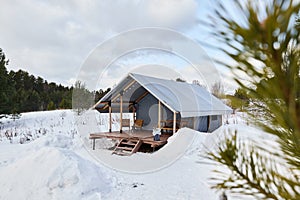 Photos of beautiful glamping in the winter forest photo