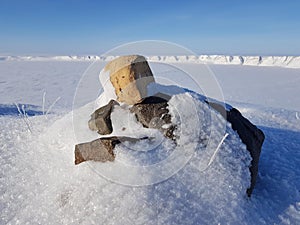 Photos of the cult object of the Nenets. Snow-covered tundra, Russia, Gydansky peninsula