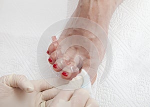 Photos of foot nail varnishing process, series of photos