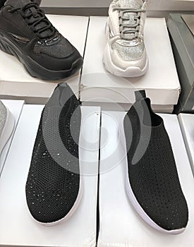 Photos of men`s shoes in the mall