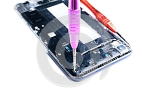 Photos showing the process of repairing a broken mobile phone with a screwdriver in the laboratory for repair of mobile equipment