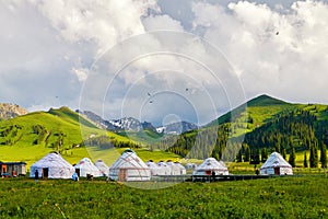 The mongolia yurts in the high mountain meadow photo