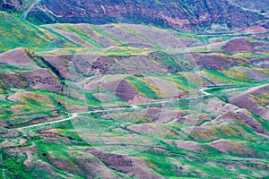 Road in colorful hillside in Tekesi county photo