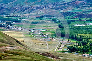 Village in valley in Tekesi county photo