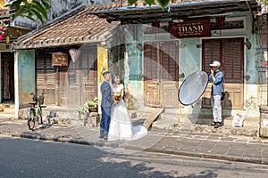 Photoshoot of and asian couple in wedding outfit in Hoi An, Vietnam