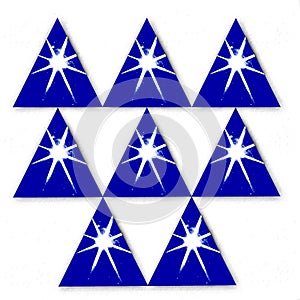 Eight blue triangles with star centers balanced on each other photo