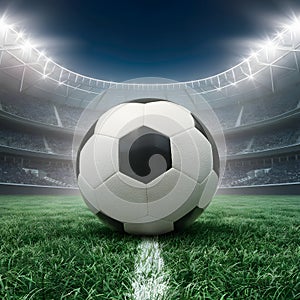 PhotoStock Soccer ball on grass field in stadium, symbolizing sportsmanship and competitive spirit