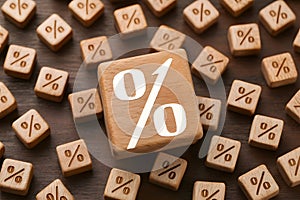 PhotoStock Wooden cubes with percentage symbol and arrows, financial growth concept