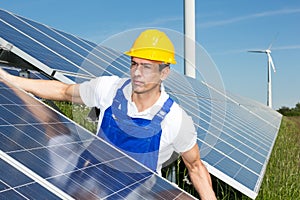 Photovoltaic engineer or installer installing solar panel