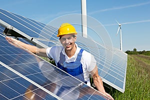 Photovoltaic engineer or installer installing solar panel