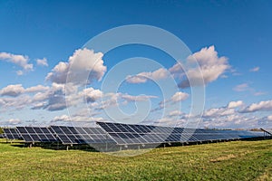 Photovoltaic panels in solar power plant. Renewable power generation concept. photo