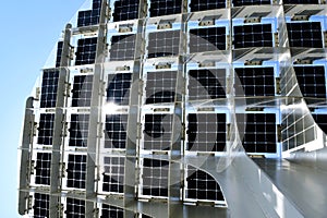Photovoltaic solar cells on top of elegant steel structure.