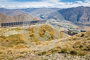 Photovoltaic solar panels above valley in Mount Aspiring National Park, New Zealand