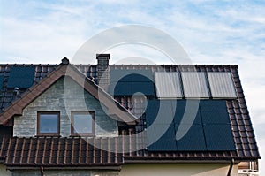 Photovoltaic solar panels on the roof of a modern house