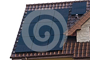 Photovoltaic solar panels on the roof of a modern house