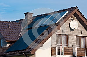 Photovoltaic solar panels on the roof of a modern house