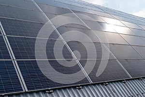 Photovoltaic solar panels on round Industrial Roof