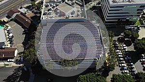 Photovoltaic solar plant on top of business building , Long Beach, aerial