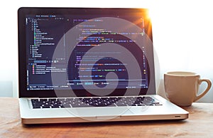 Php code on laptop web developing and white mug in sunlight