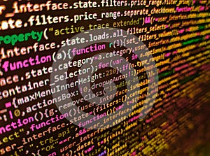 PHP development, software site code. Close up of random computer code comprised of numbers and letters. IT coding on monitor