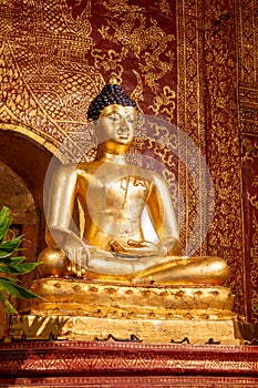 The Phra Buddha Sihing statue in the Viharn Lai Kham at Wat Phra Singh , Chiang Mai , Thailand