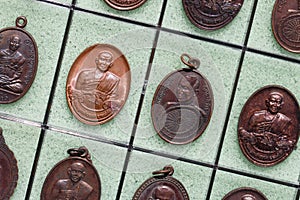 Phra Khuva Boonchum coins , Small Buddha image or Thai amulet