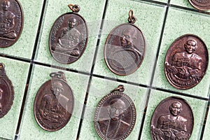 Phra Khuva Boonchum coins , Small Buddha image or Thai amulet