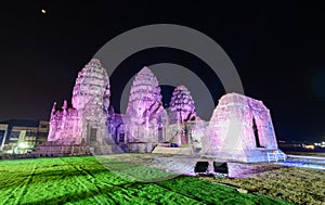 Phra Prang Sam Yot decorated with lights at night. It is a famous historical tourist attraction in Lop buri