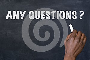 Phrase Any questions written on blackboard photo