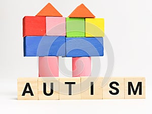 Phrase AUTISM on wooden cubes