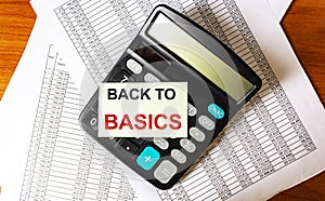 The phrase BACK TO BASICS on the sticker on the calculator and on documents