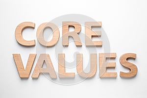 Phrase CORE VALUES made of wooden letters on white background, top view