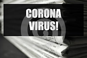 Phrase Corona Virus and stack of newspapers. Journalist`s work